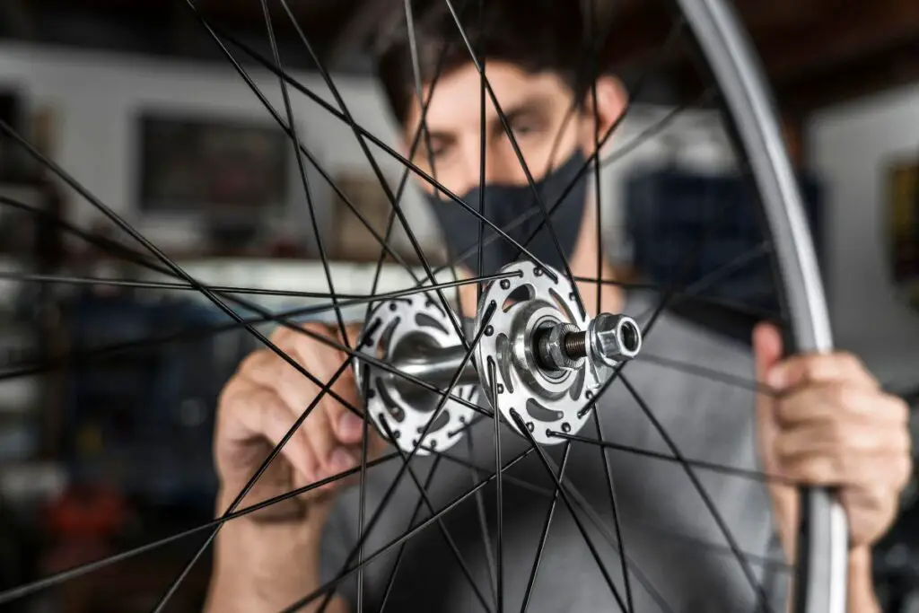 Mechanic adjusting the hub during a cartridge bearing replacement