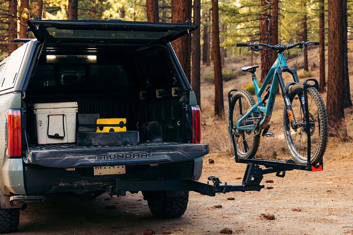 Hollywood Racks SideTrack swing-away adapter holding a mountain bike on a Toyota Tundra pickup